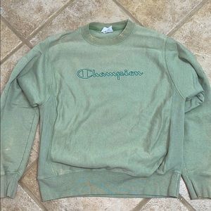 Green champion sweatshirt.
